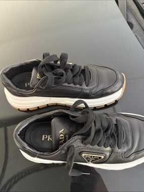 Prada Black Leather Platform Sneakers with White Midsole and Gum Outsole